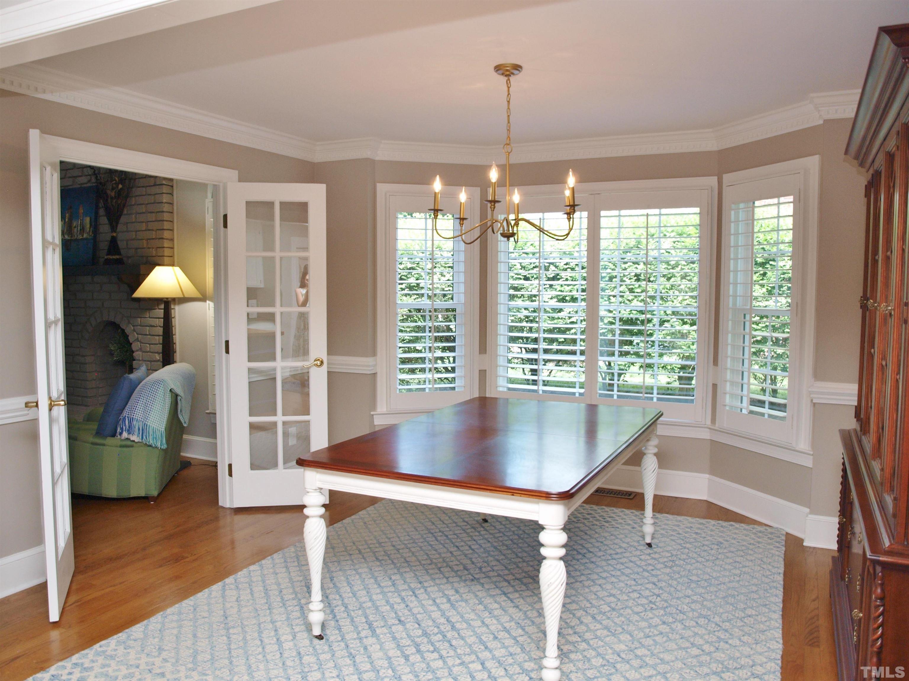 2905 Bolo Trail Raleigh, NC 27615 - Photo 10 of 25 a dining room with furniture and a floor to ceiling window