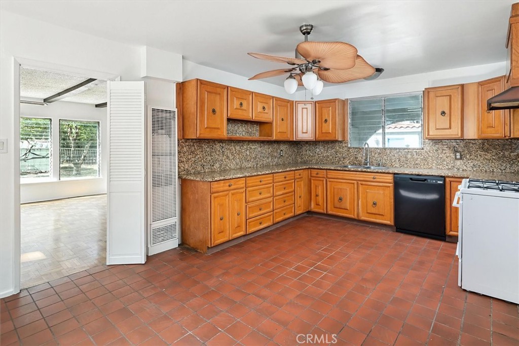 9953 La Tuna Canyon Road Sun Valley, CA 91352 - Photo 11 of 32 a kitchen with stainless steel appliances granite countertop a sink and cabinets