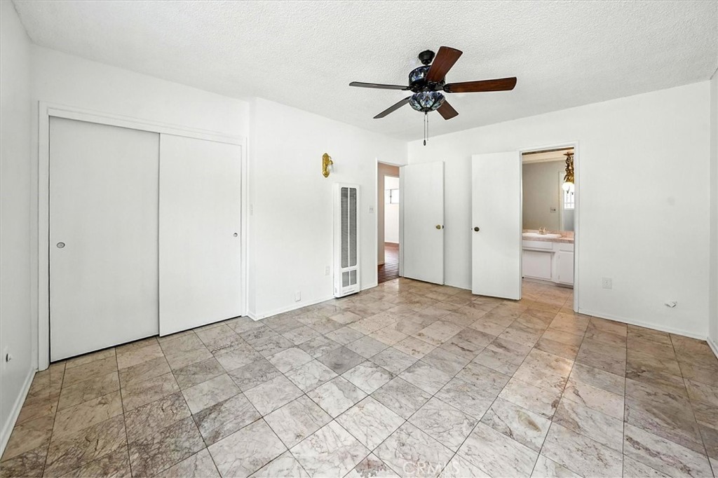 9953 La Tuna Canyon Road Sun Valley, CA 91352 - Photo 13 of 32 a view of empty room with wooden floor and ceiling fan