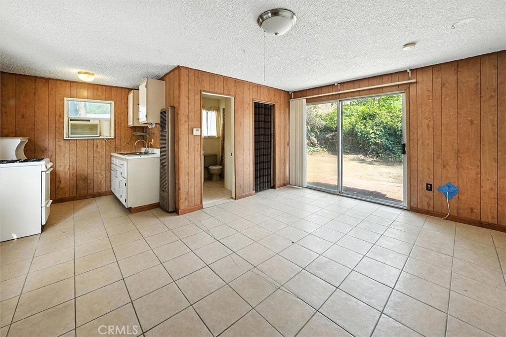 9953 La Tuna Canyon Road Sun Valley, CA 91352 - Photo 21 of 32 a view of a kitchen with refrigerator and a stove
