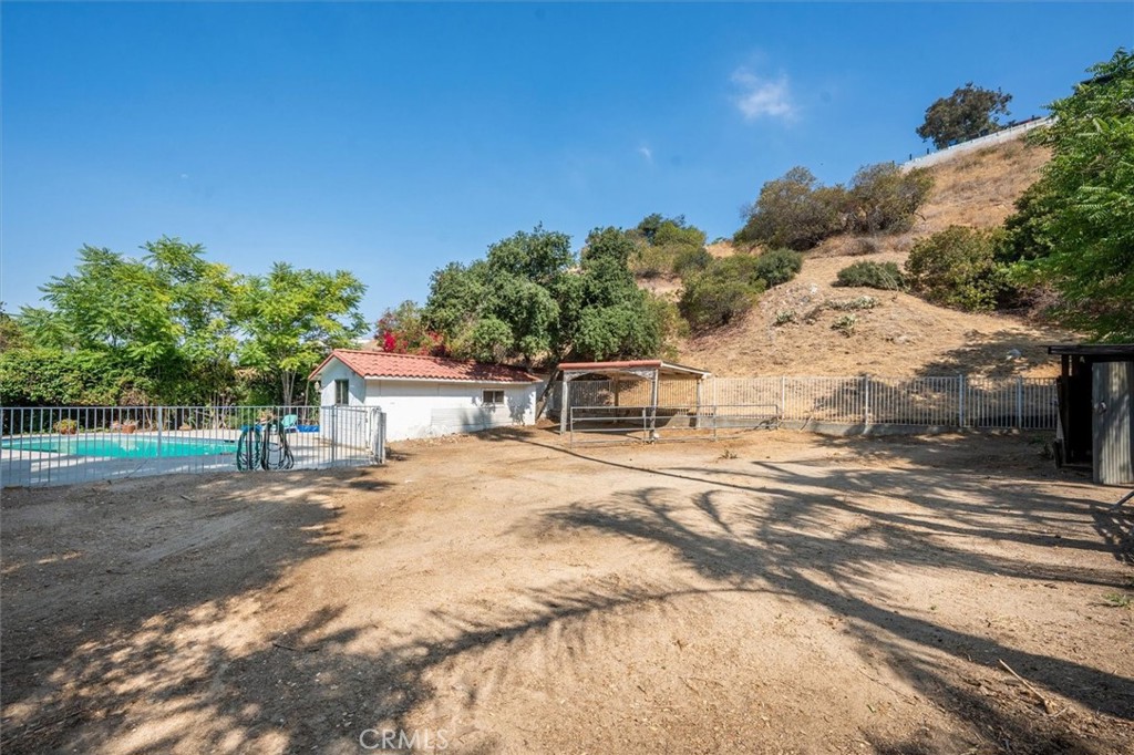 9953 La Tuna Canyon Road Sun Valley, CA 91352 - Photo 27 of 32 a front view of a house with a yard and garage