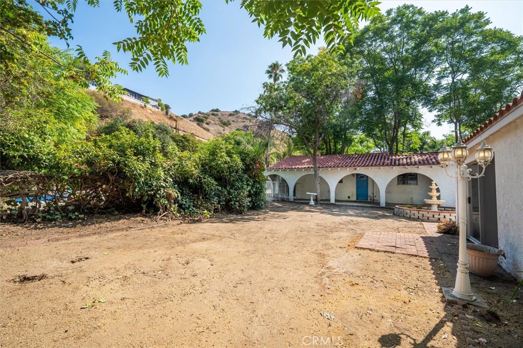 9953 La Tuna Canyon Road Sun Valley, CA 91352 - Photo 28 of 32 a front view of a house with a yard covered in snow
