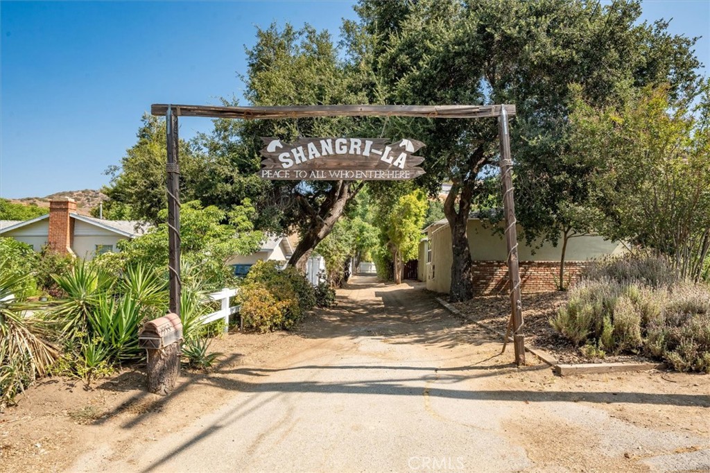 9953 La Tuna Canyon Road Sun Valley, CA 91352 - Photo 4 of 32 a street sign on a sidewalk next to a road