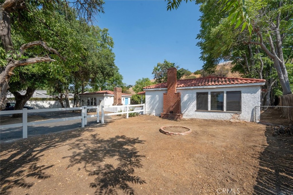 9953 La Tuna Canyon Road Sun Valley, CA 91352 - Photo 6 of 32 a front view of a house with a garden and tree