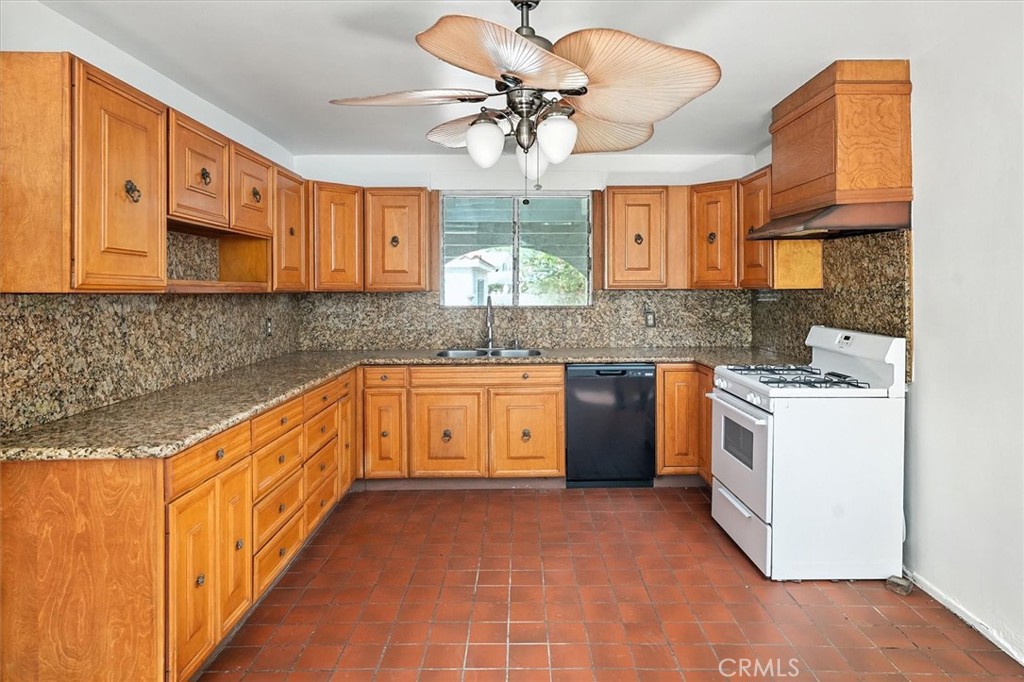 9953 La Tuna Canyon Road Sun Valley, CA 91352 - Photo 10 of 32 a kitchen with a sink stove and cabinets
