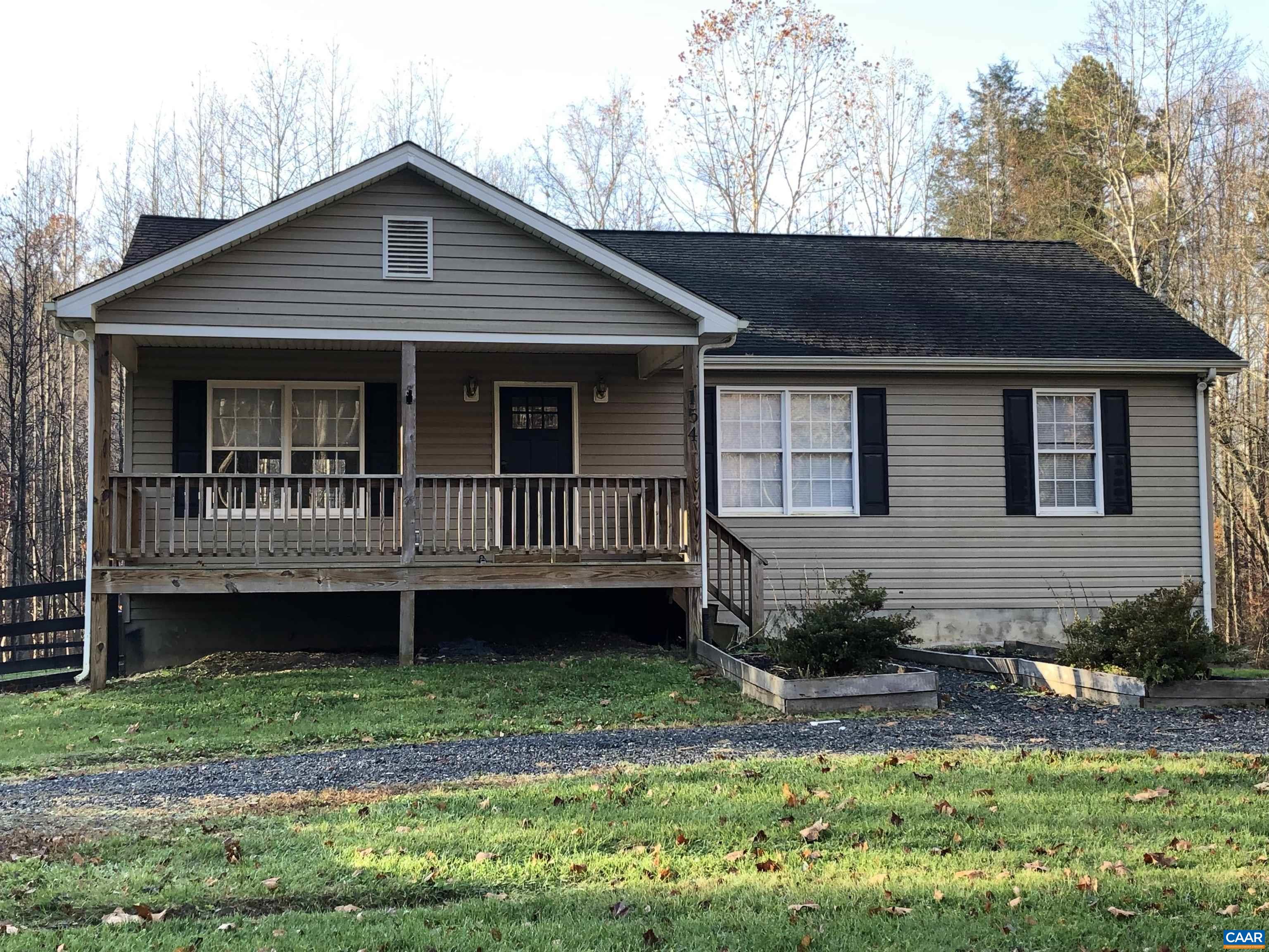154 Rambling Road Ruckersville, VA 22968 - Photo 1 of 1 a front view of a house with a yard and outdoor seating