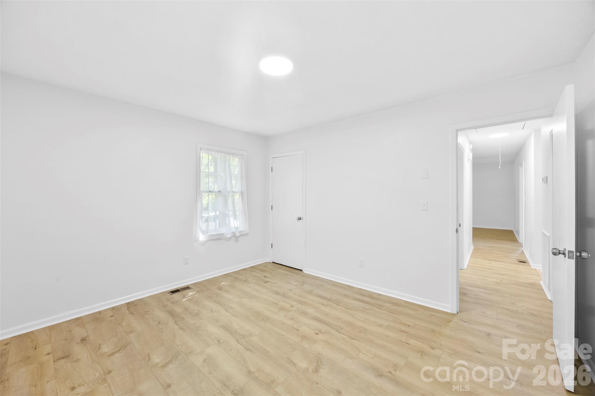 509 California Circle York, SC 29745 - Photo 13 of 26 a view of empty room with wooden floor and fan