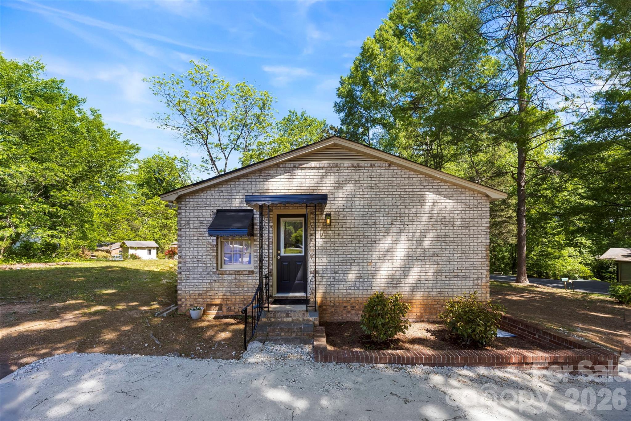 509 California Circle York, SC 29745 - Photo 21 of 26 a backyard of a house with a yard and garage