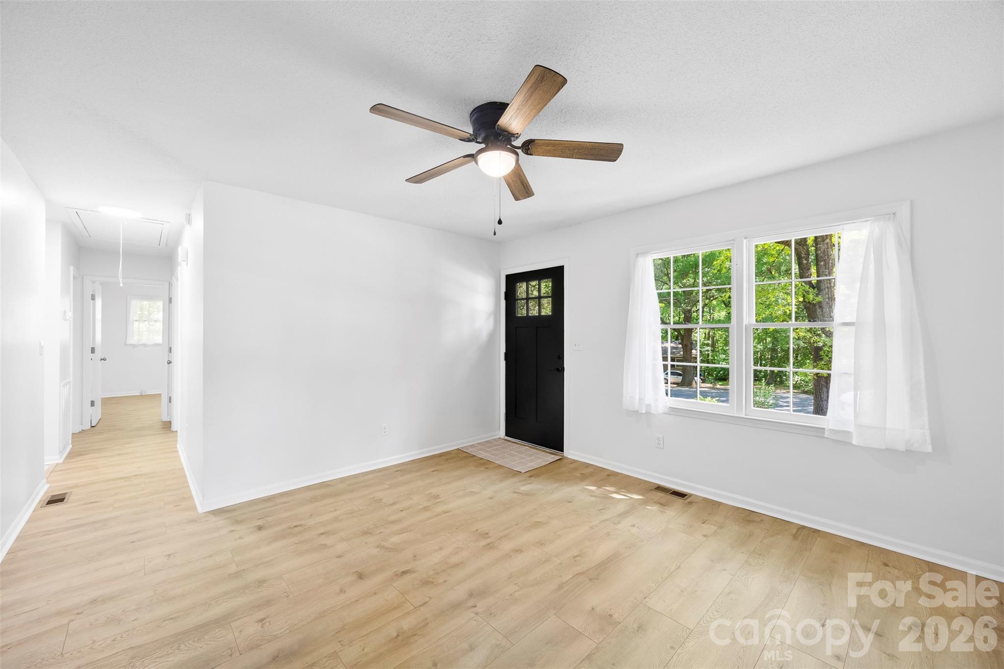 509 California Circle York, SC 29745 - Photo 6 of 26 a view of a livingroom with a window and a ceiling fan