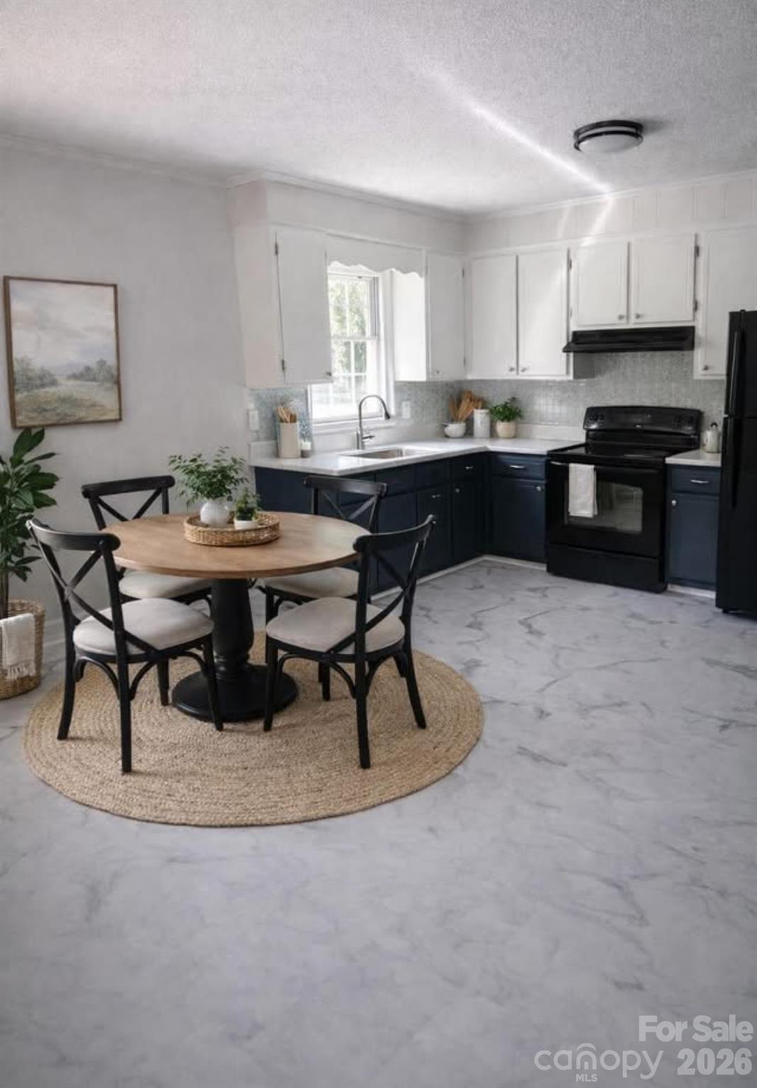 509 California Circle York, SC 29745 - Photo 7 of 26 a kitchen with a table and chairs in it