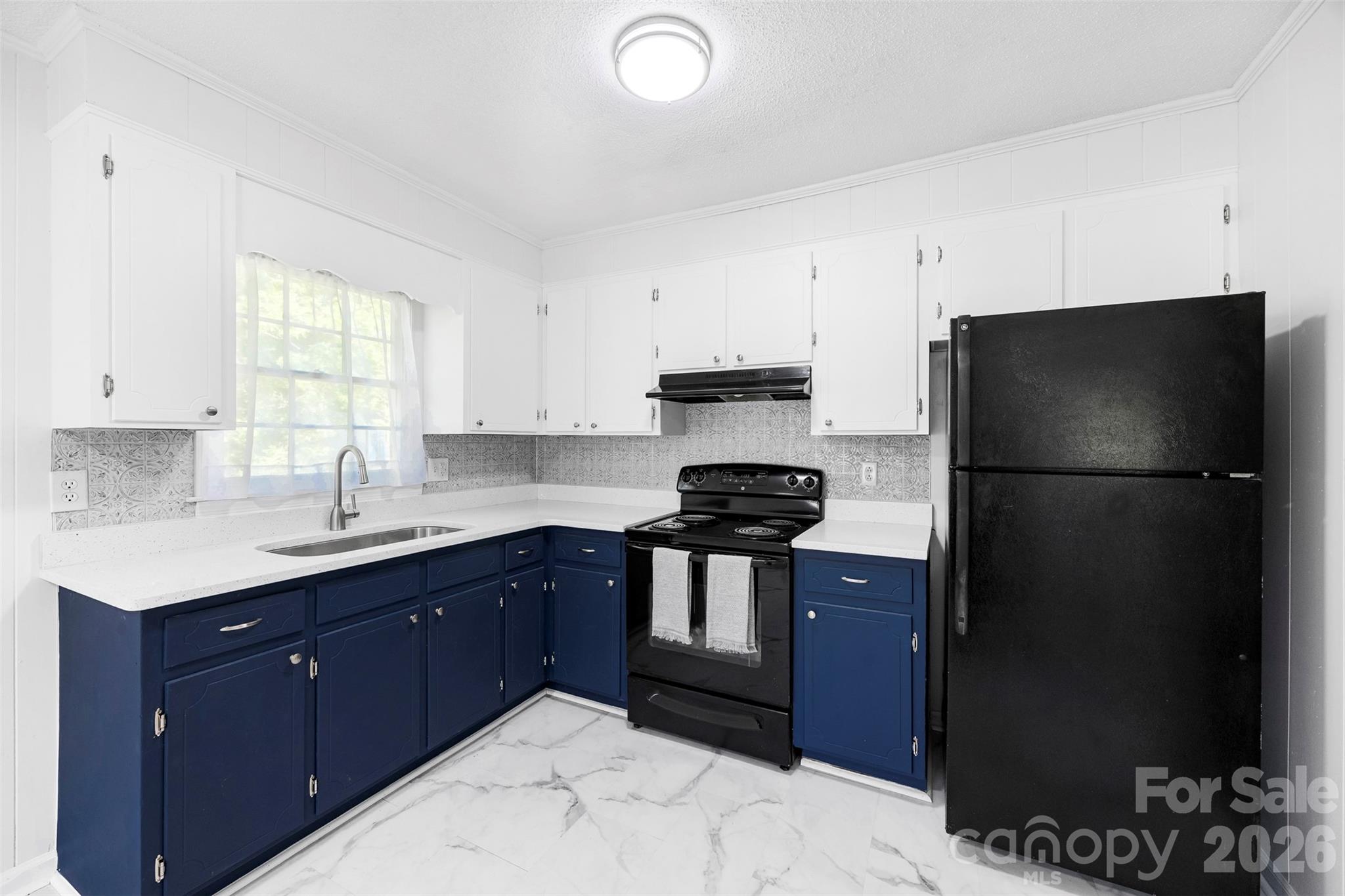509 California Circle York, SC 29745 - Photo 8 of 26 a kitchen with a refrigerator and a sink