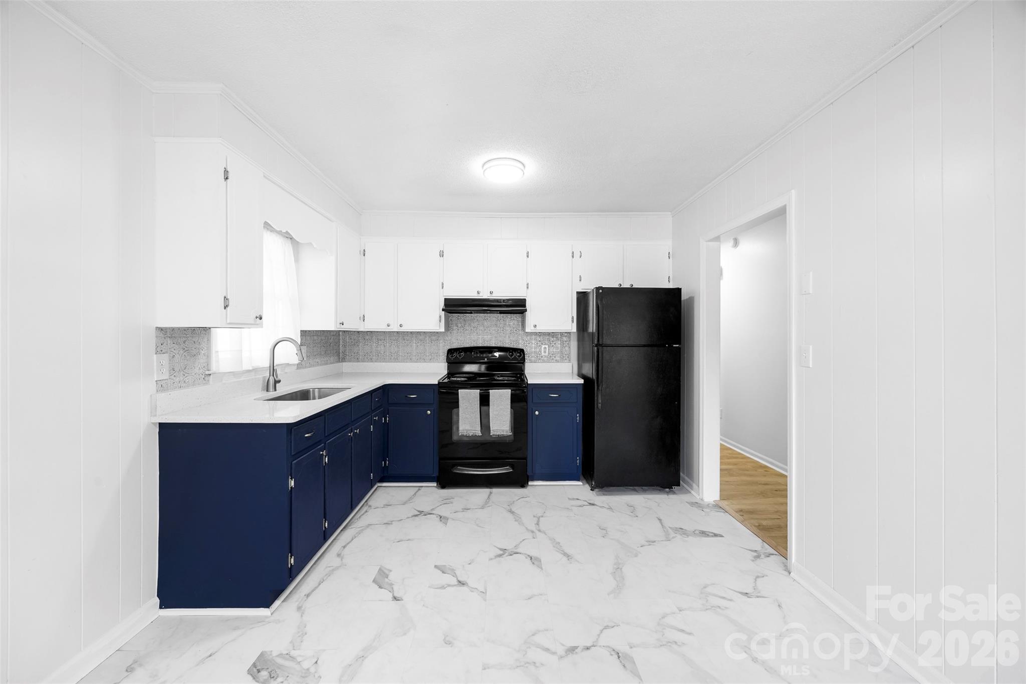 509 California Circle York, SC 29745 - Photo 10 of 26 a kitchen with a refrigerator and a sink