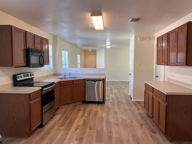 a view of a swimming pool with a yard