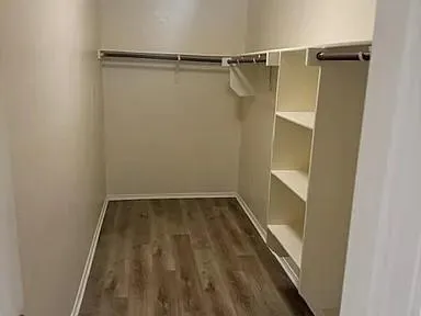 a view of cabinets with wooden floor