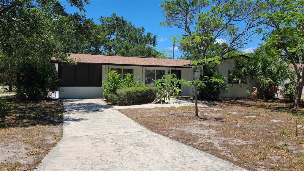 4611 West Villa Rosa Street Tampa, FL 33611 - Photo 1 of 22 a view of house with yard