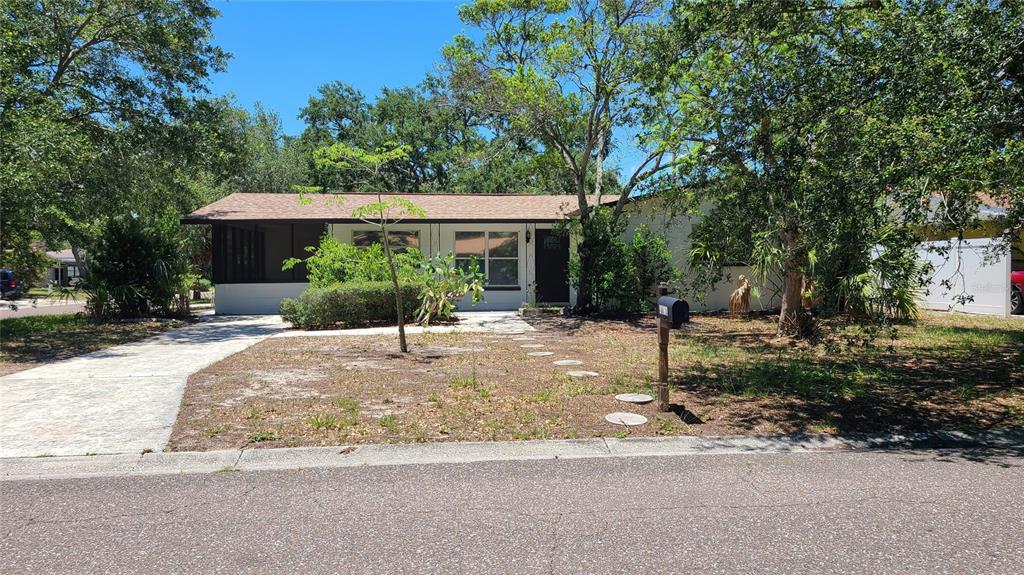 4611 West Villa Rosa Street Tampa, FL 33611 - Photo 3 of 22 a view of a house with yard and a garden