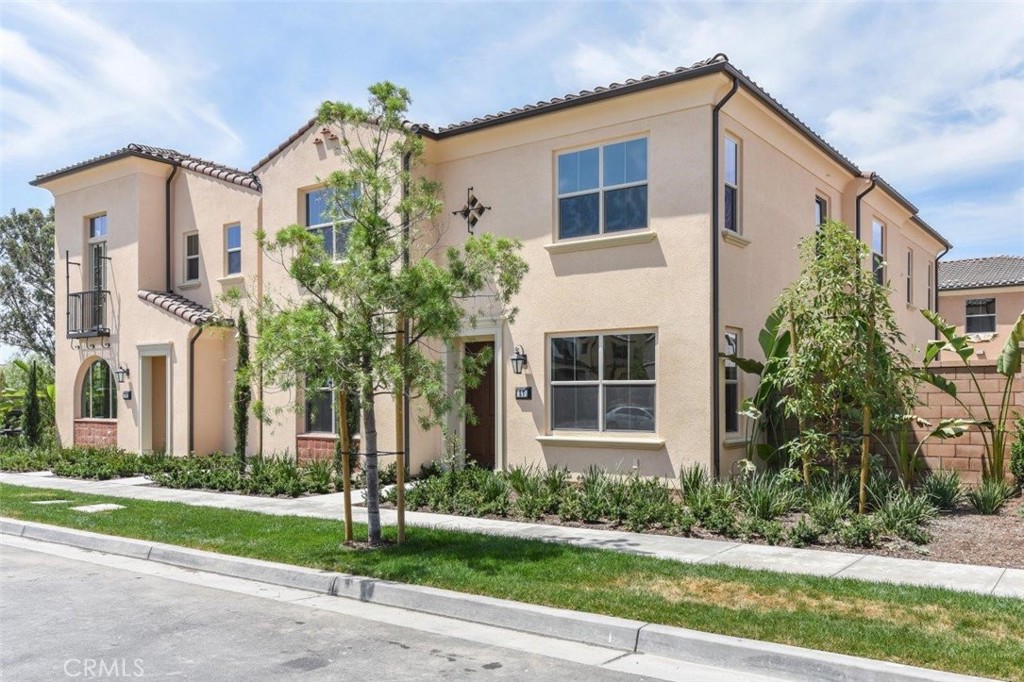 a front view of a house with a yard and a garage
