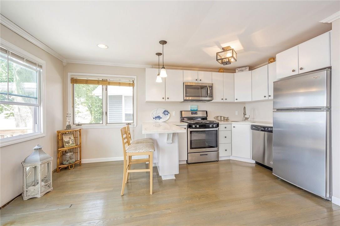 58 Indian Trail, Unit 58 Bronx, NY 10465 - Photo 3 of 29 Eat in kitchen with quartz counters back splash and stainless steel appliances