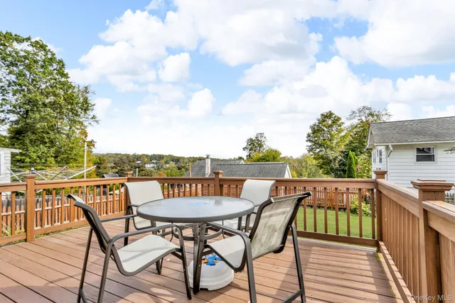 a view of a chairs and table on the deck