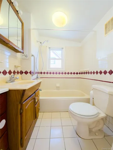 a bathroom with a sink a toilet and bathtub