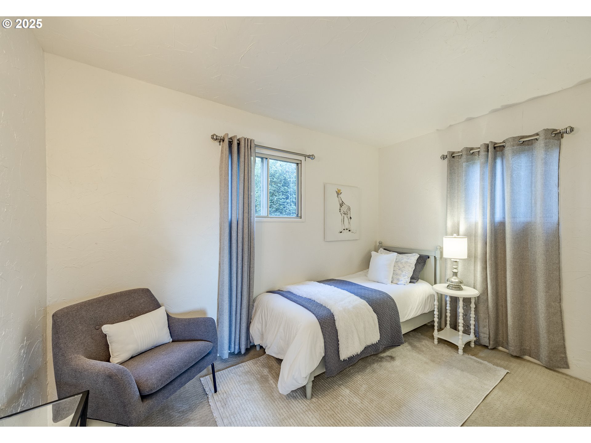 83694 Rio Road Florence, OR 97439 - Photo 20 of 45 a bedroom with a bed and a couch