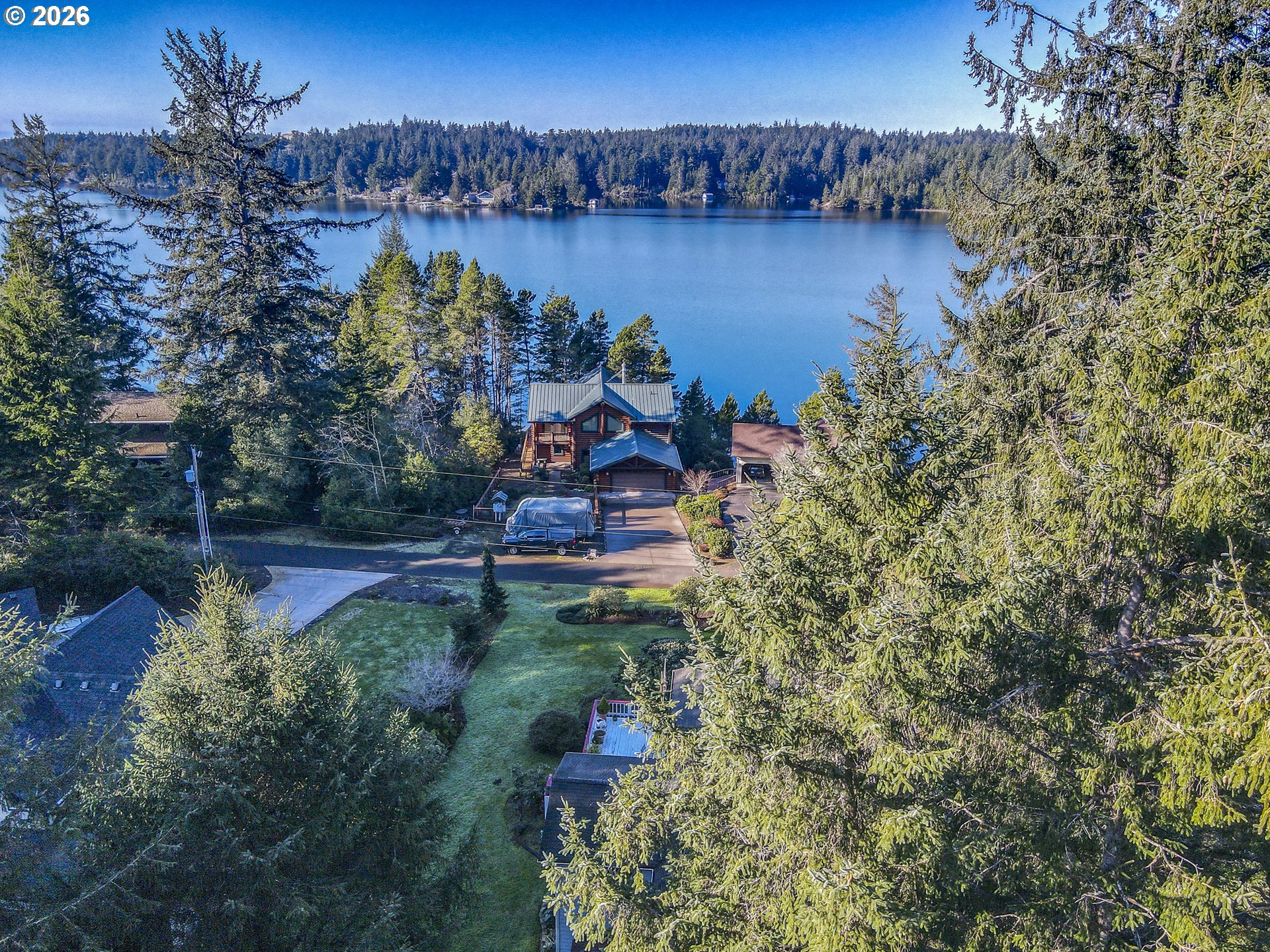 83694 Rio Road Florence, OR 97439 - Photo 38 of 45 a view of a lake with a mountain in the background