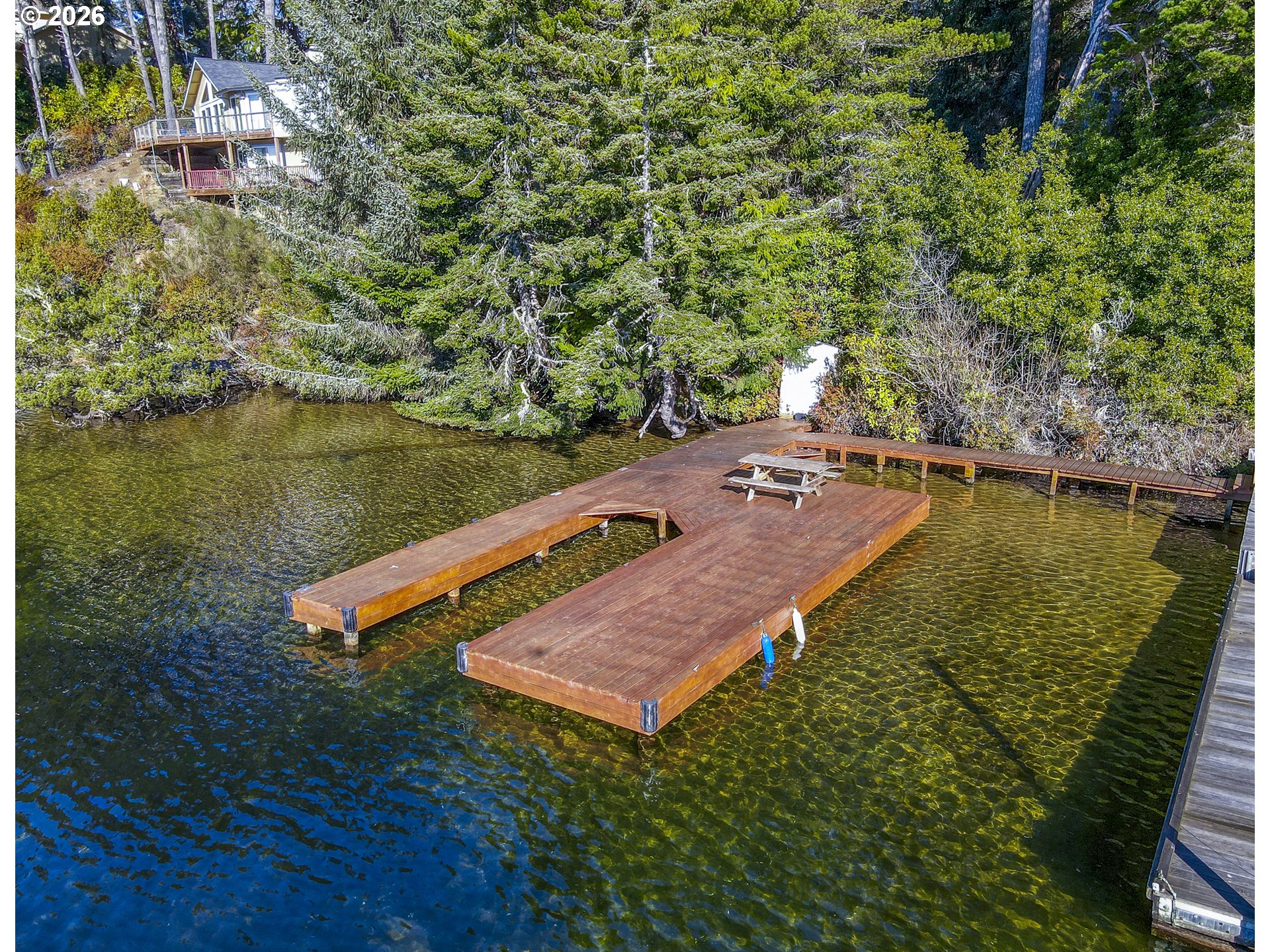 83694 Rio Road Florence, OR 97439 - Photo 44 of 45 an aerial view of a house with a lake view
