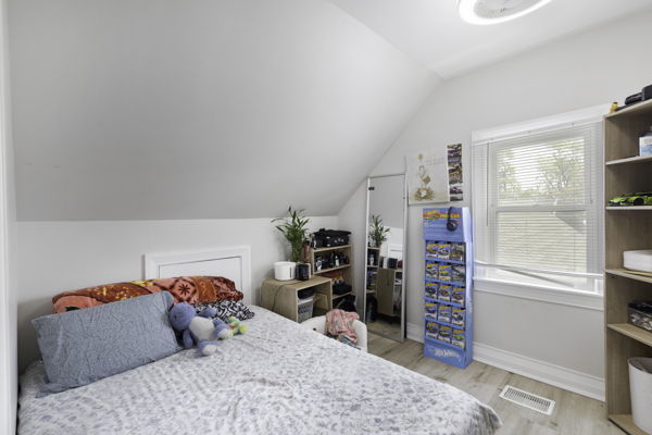 2623 North Rhodes Avenue River Grove, IL 60171 - Photo 10 of 17 a bedroom with a bed and a window