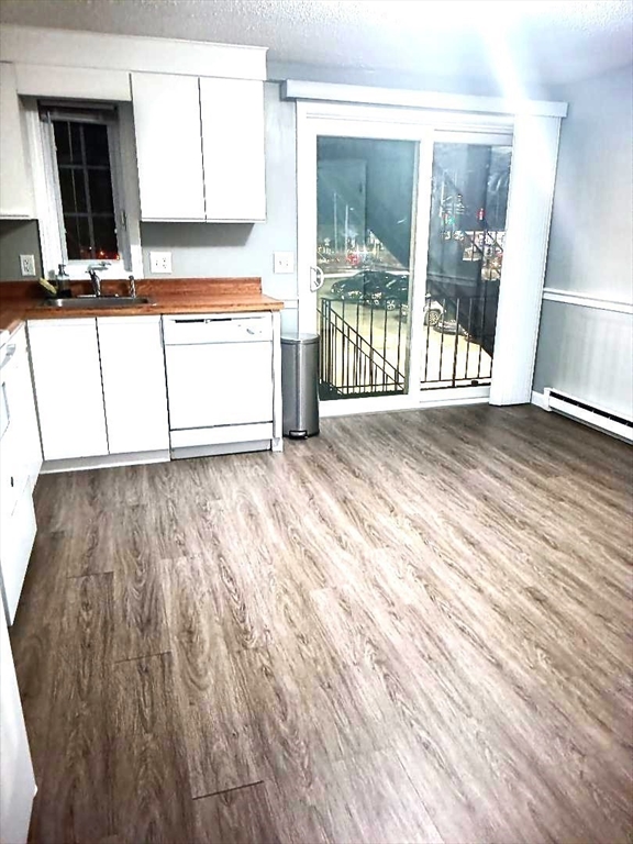 1821 Middlesex Street, Unit 10 Lowell, MA 01851 - Photo 3 of 6 en view interior of the house and wooden floor