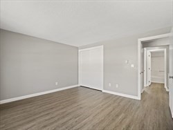 1821 Middlesex Street, Unit 10 Lowell, MA 01851 - Photo 4 of 6 a view of an empty room with wooden floor