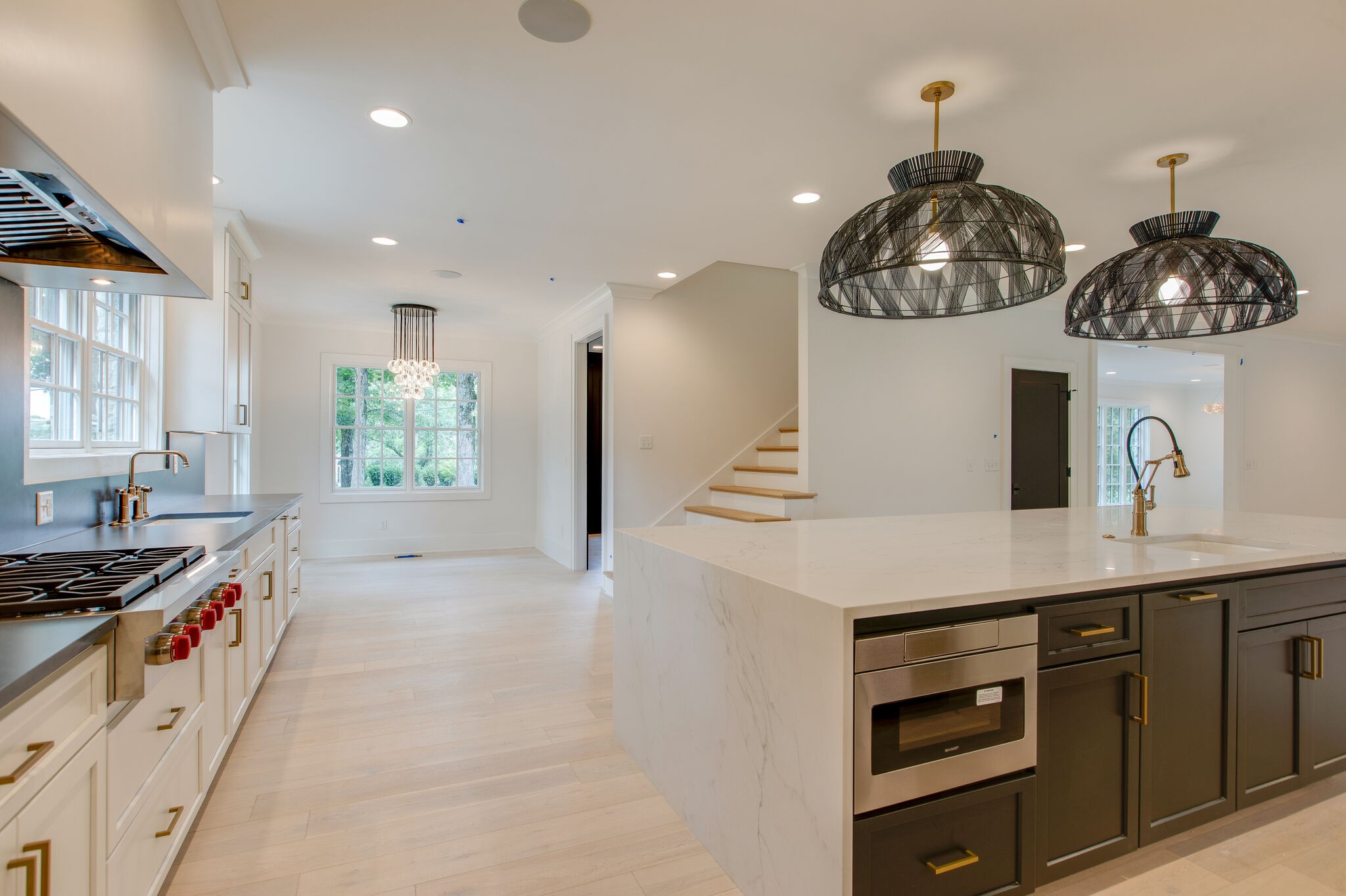3800 Estes Road Nashville, TN 37215 - Photo 27 of 50 a kitchen with stainless steel appliances a stove a sink and a wooden floors