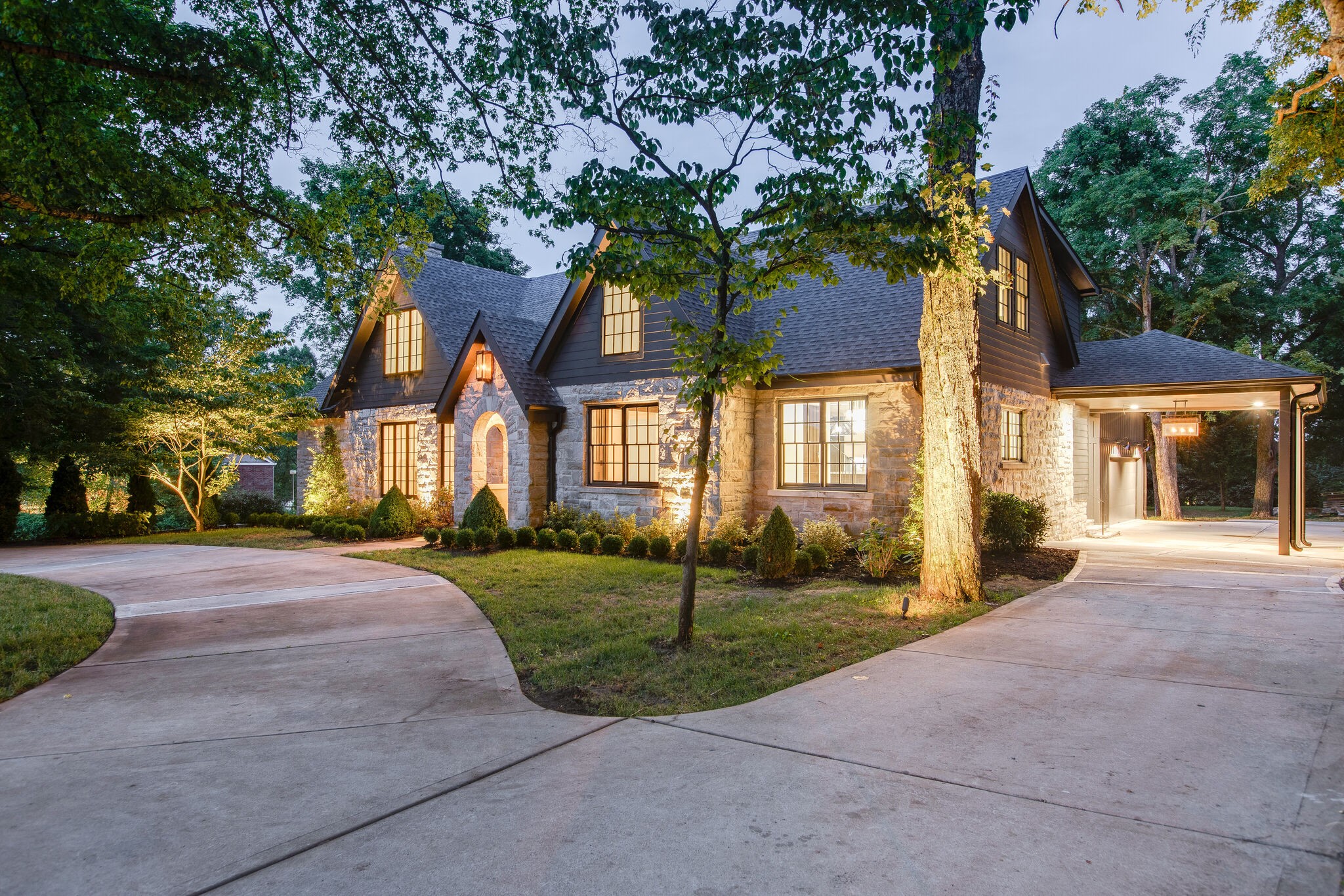 3800 Estes Road Nashville, TN 37215 - Photo 3 of 50 a view of a brick house next to a yard with big trees