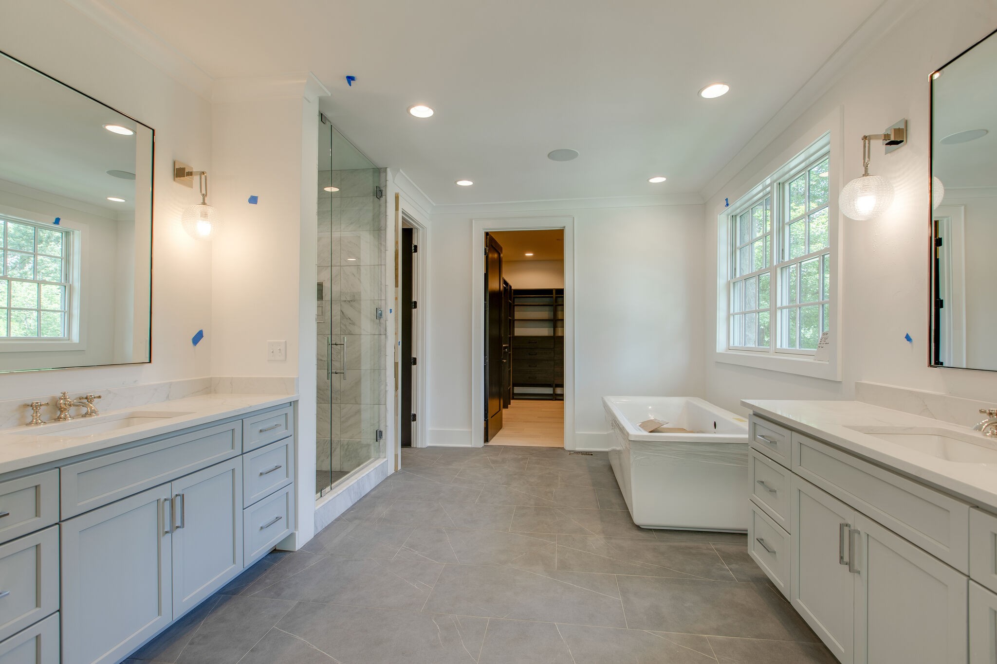 3800 Estes Road Nashville, TN 37215 - Photo 37 of 50 a spacious bathroom with a double vanity sink a large mirror and a bathtub