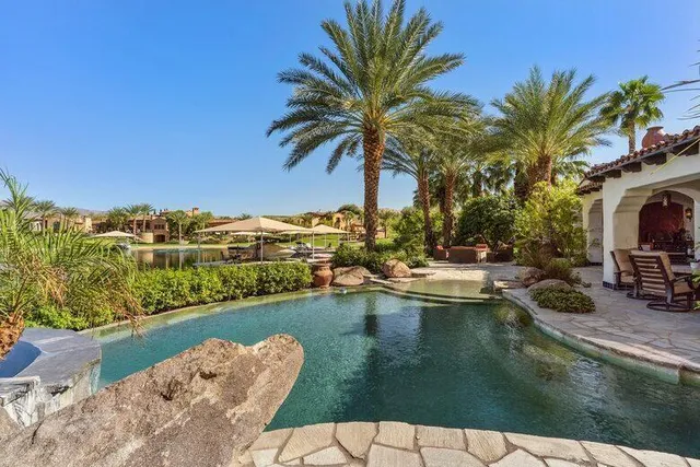 a bedroom with a bed and flat screen tv