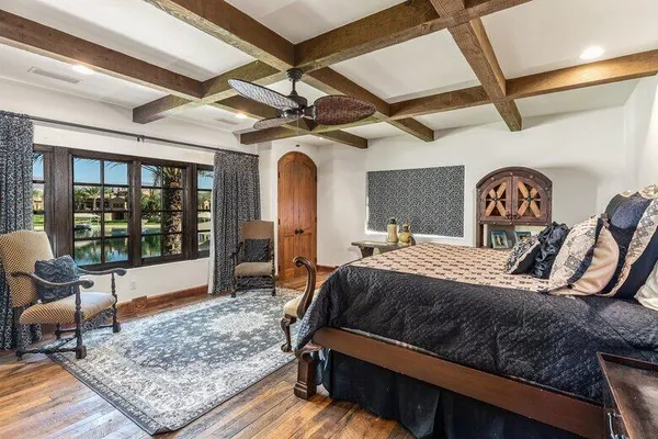 walk in closet with wooden floor