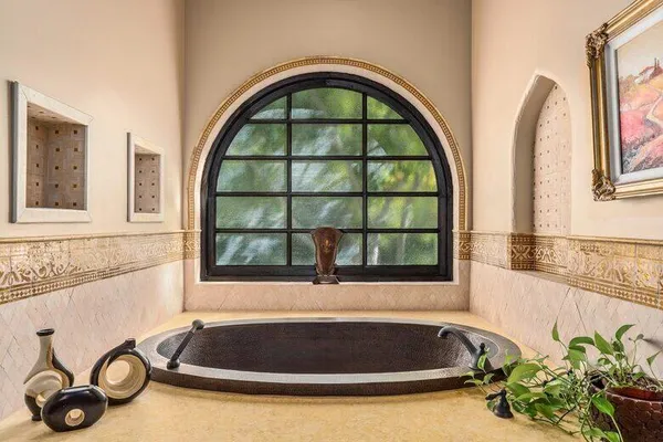 a spacious bathroom with a sink double vanity and a mirror