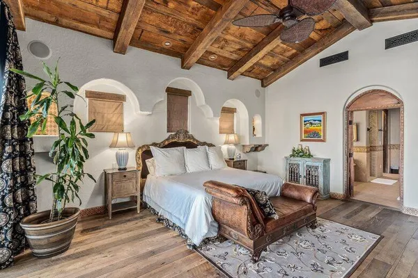 a bedroom with a bed and a fireplace