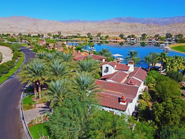 a dining table with chairs and window