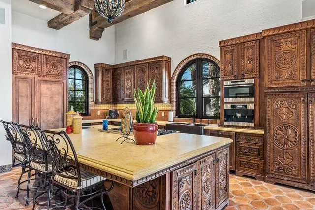 a living room with furniture ceiling fan and a rug