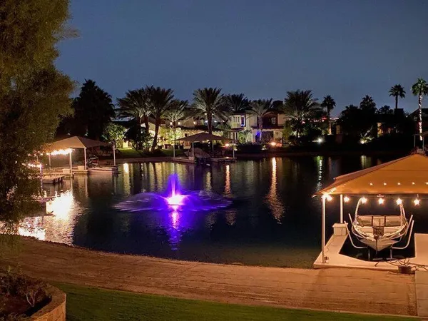 an outdoor living space with furniture and city view