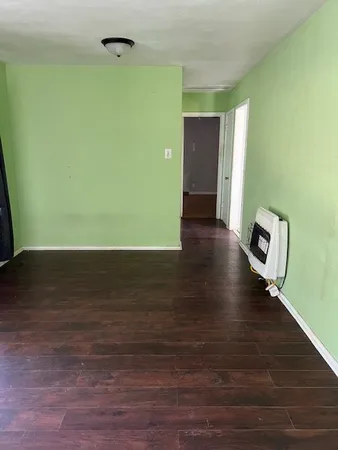 a view of a livingroom with wooden floor