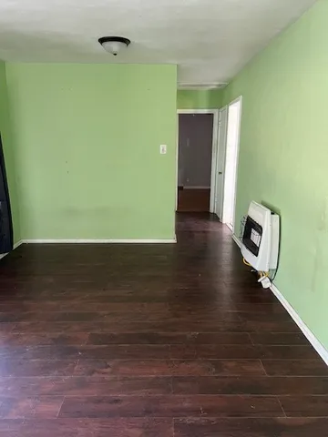 a view of a livingroom with wooden floor