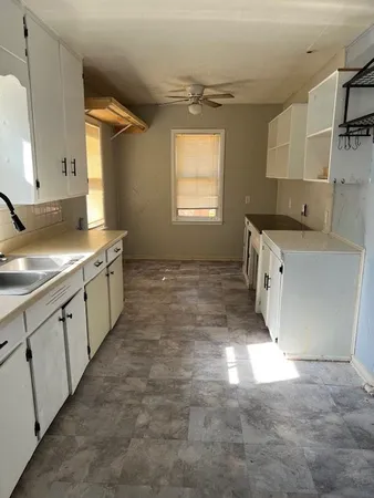 a view of a refrigerator in wooden floor