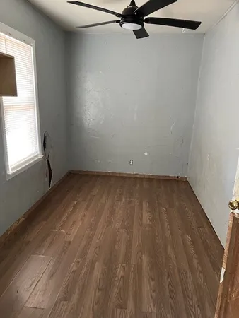 a view of a livingroom with wooden floor