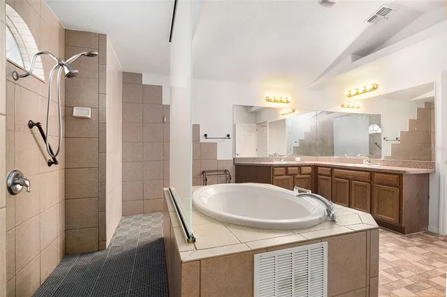 a kitchen with a sink a stove a refrigerator and cabinets