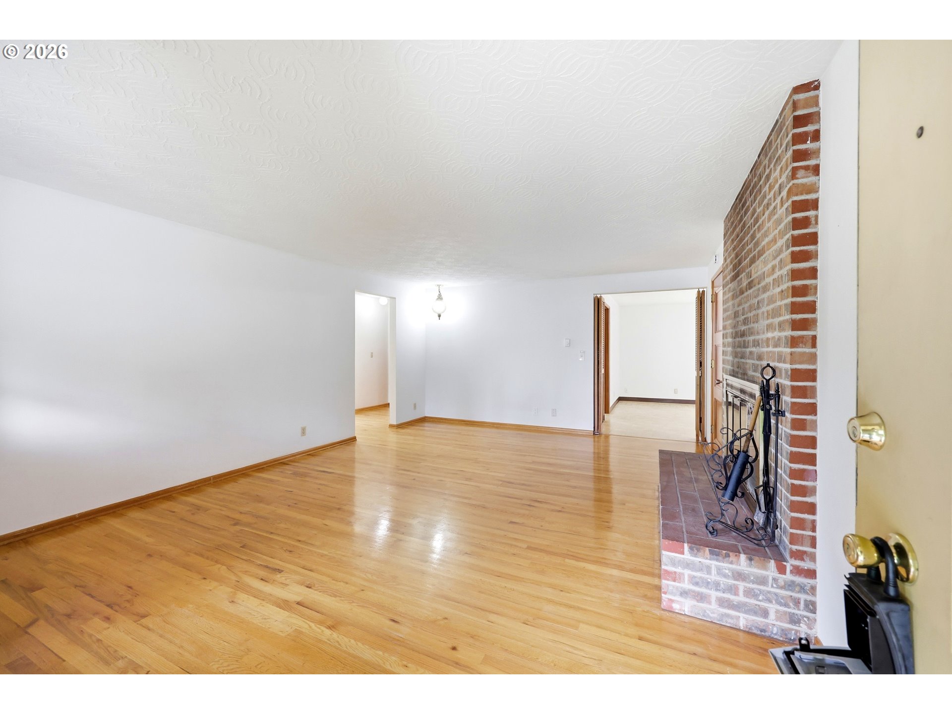 3003 Southeast 162nd Avenue Portland, OR 97236 - Photo 8 of 41 a view of empty room with wooden floor