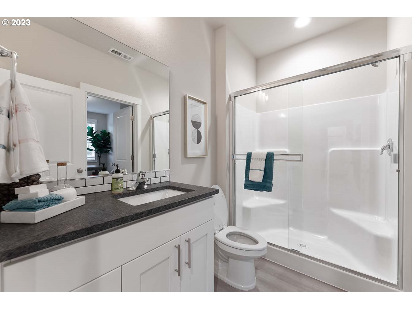 8903 North 5th Street, Unit 63 Ridgefield, WA 98642 - Photo 31 of 32 a bathroom with a sink a toilet and shower