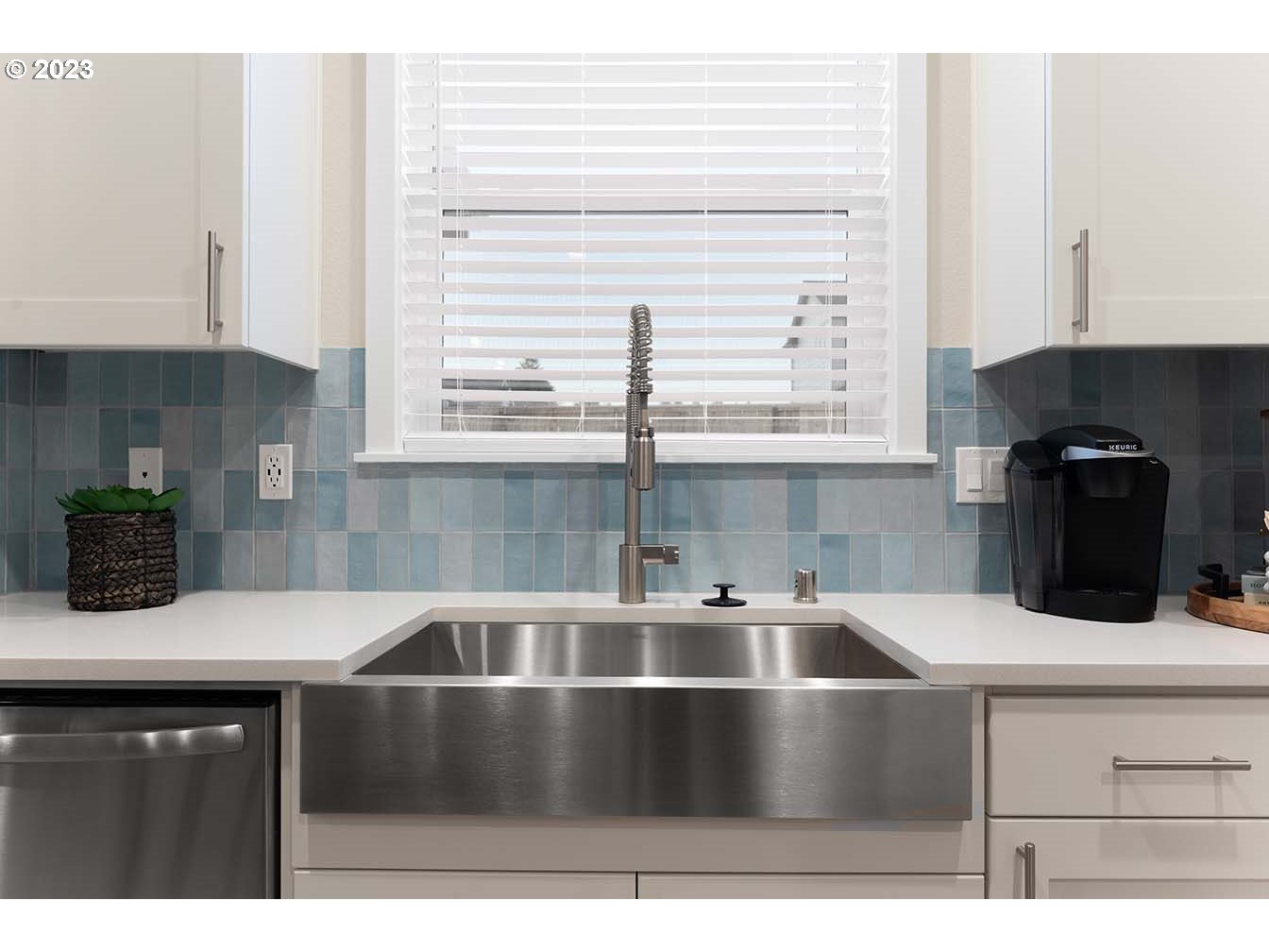 8903 North 5th Street, Unit 63 Ridgefield, WA 98642 - Photo 5 of 32 a kitchen with a sink and white cabinets