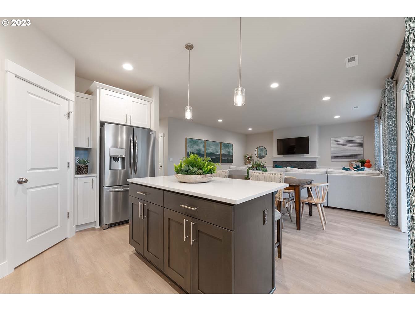 8903 North 5th Street, Unit 63 Ridgefield, WA 98642 - Photo 10 of 32 a kitchen with kitchen island white cabinets and stainless steel appliances