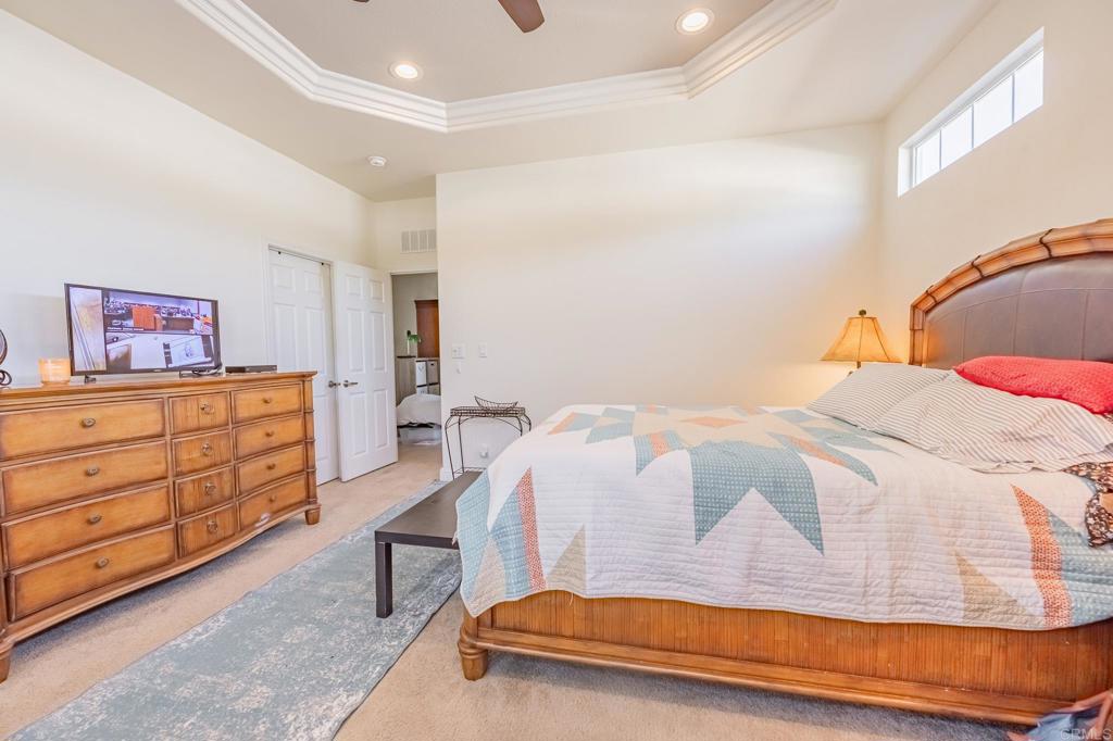 4650 Dulin Road, Unit 126 Fallbrook, CA 92003 - Photo 12 of 41 a bedroom with a bed and dresser